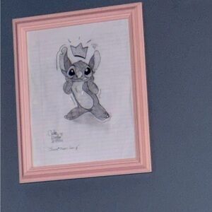 Handmade stitch drawing in pink frame